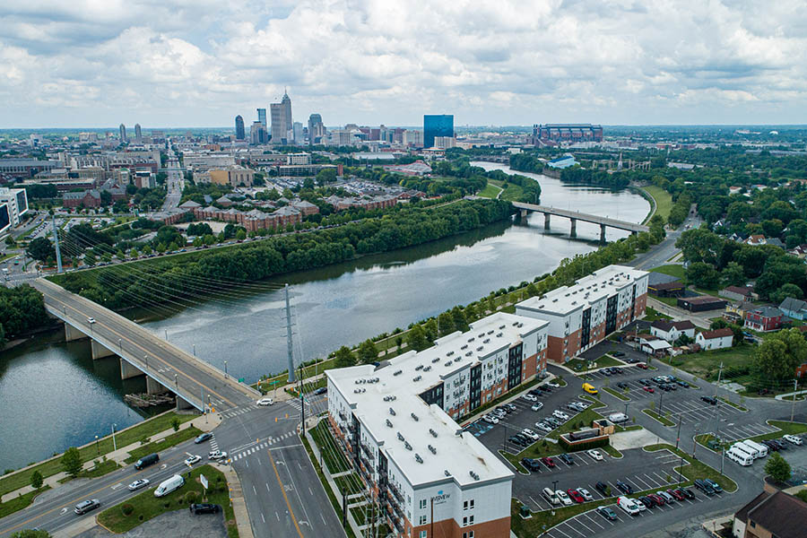 Bird-eye view of Riverview apartments right next to a beautiful river.